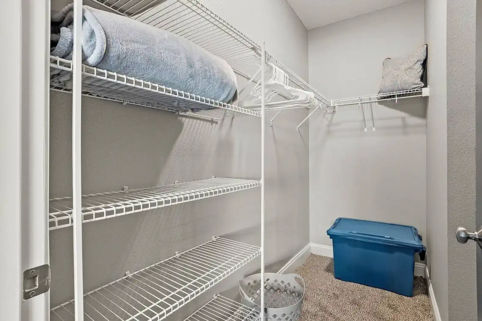 Spacious walk-in closet with plenty of shelving and hanging space, plus extra room for luggage or longer stays. Clean, organized, and practical—easy to settle in without living out of a suitcase.