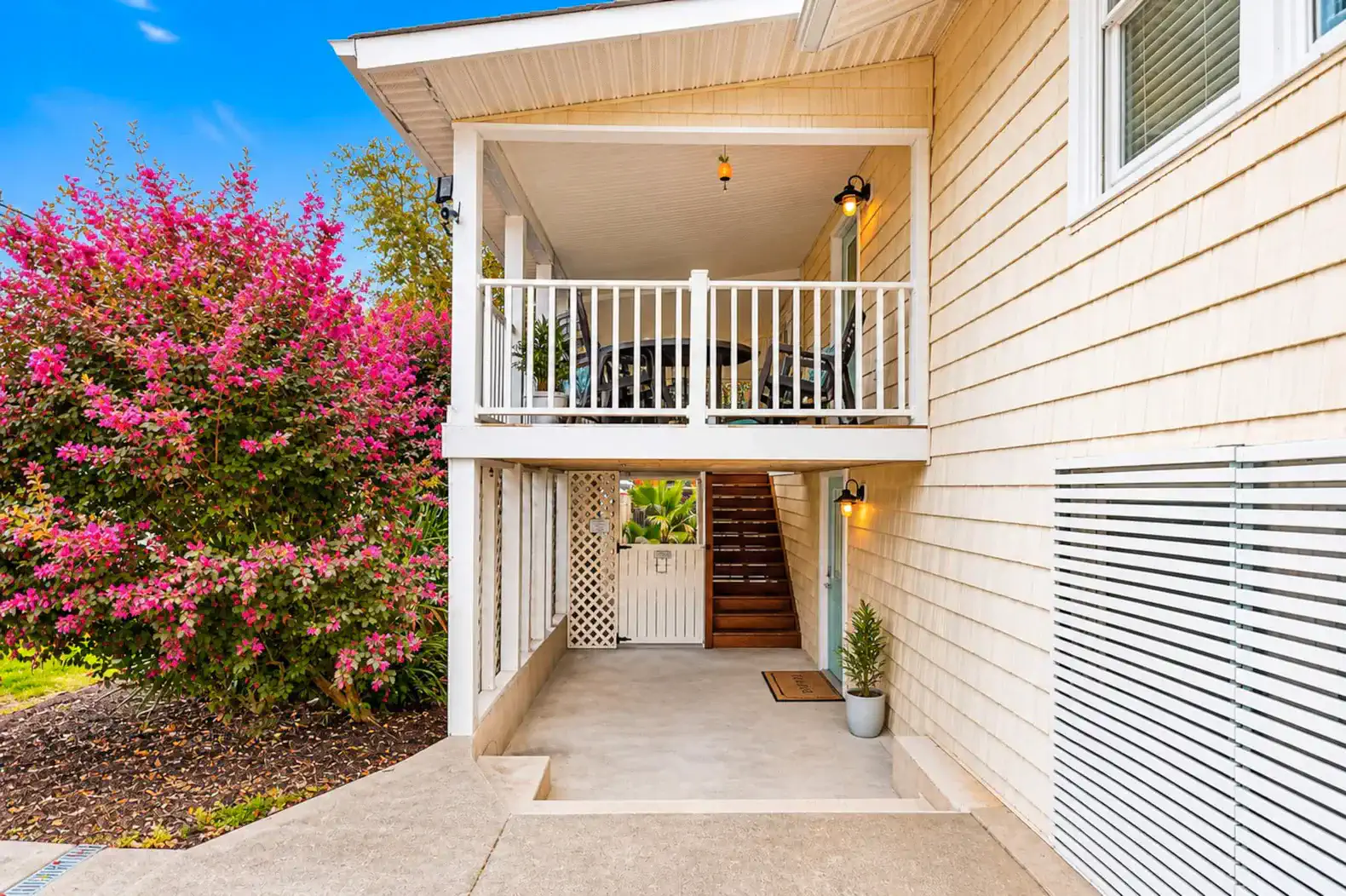Stairs to upper deck or pool area through gate