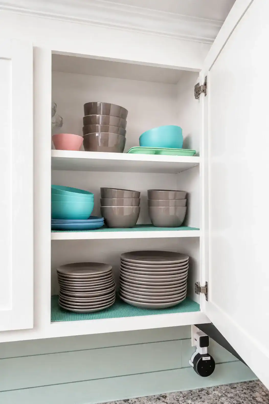 Plenty of dishes along with plastic dishware as well.