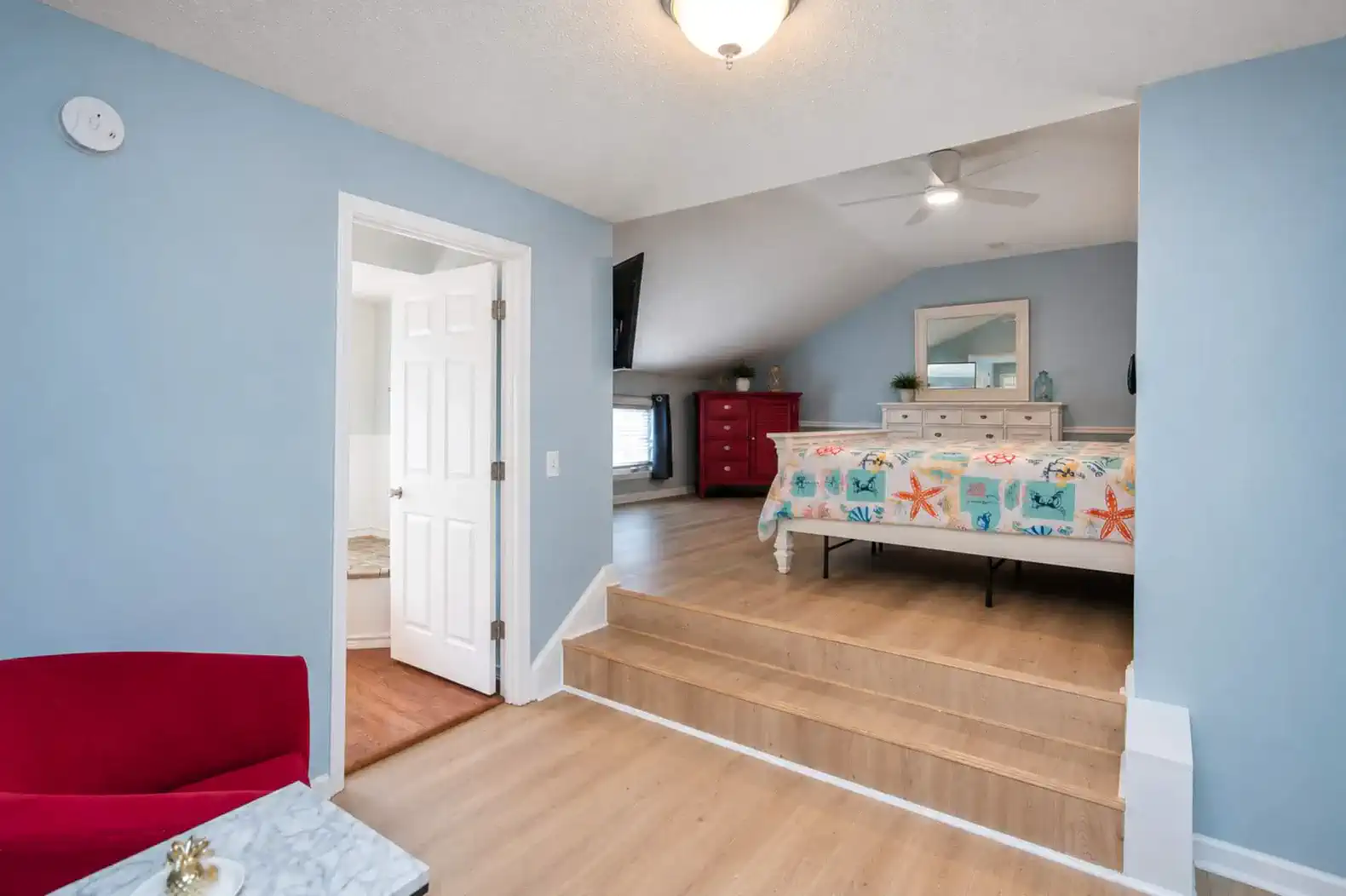 There are two stairs up to the Bed area