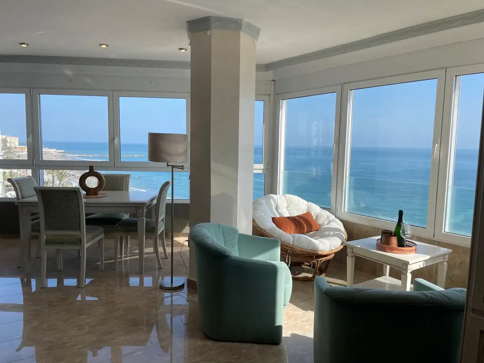 Bright living room with panoramic sea views and modern furnishings