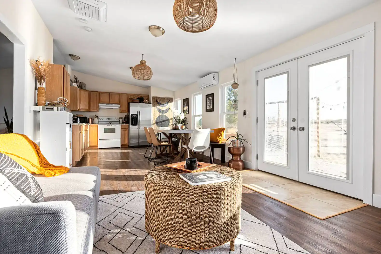 Cozy living area with kitchen, dining table, and access to outdoor space