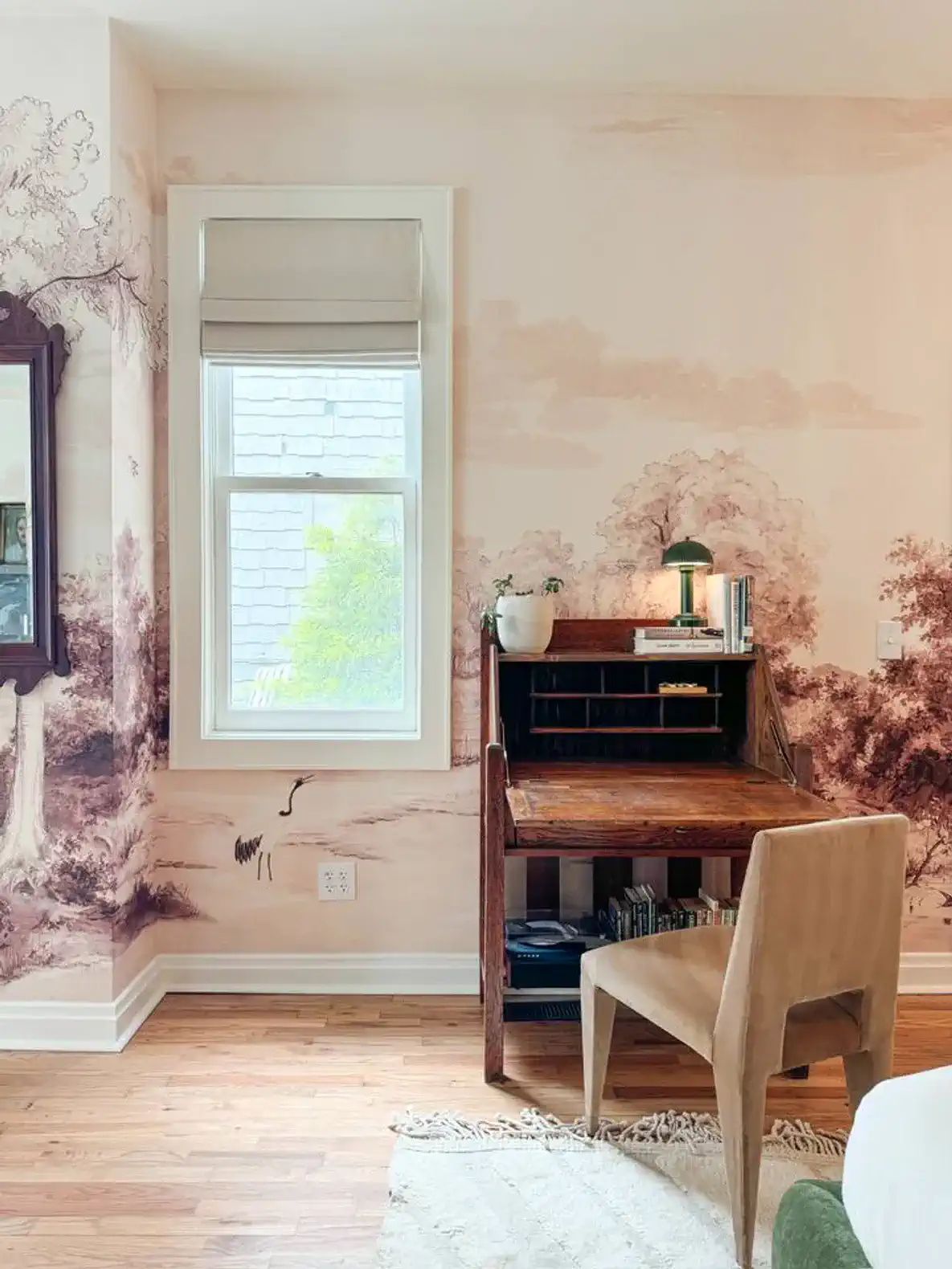 A small desk with a record player, and plenty of books to read.