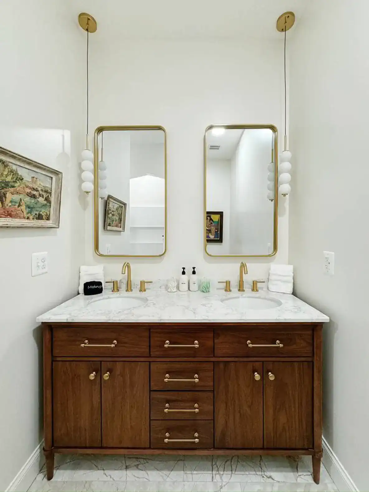 Double vanity with amenities and a hair dryer.