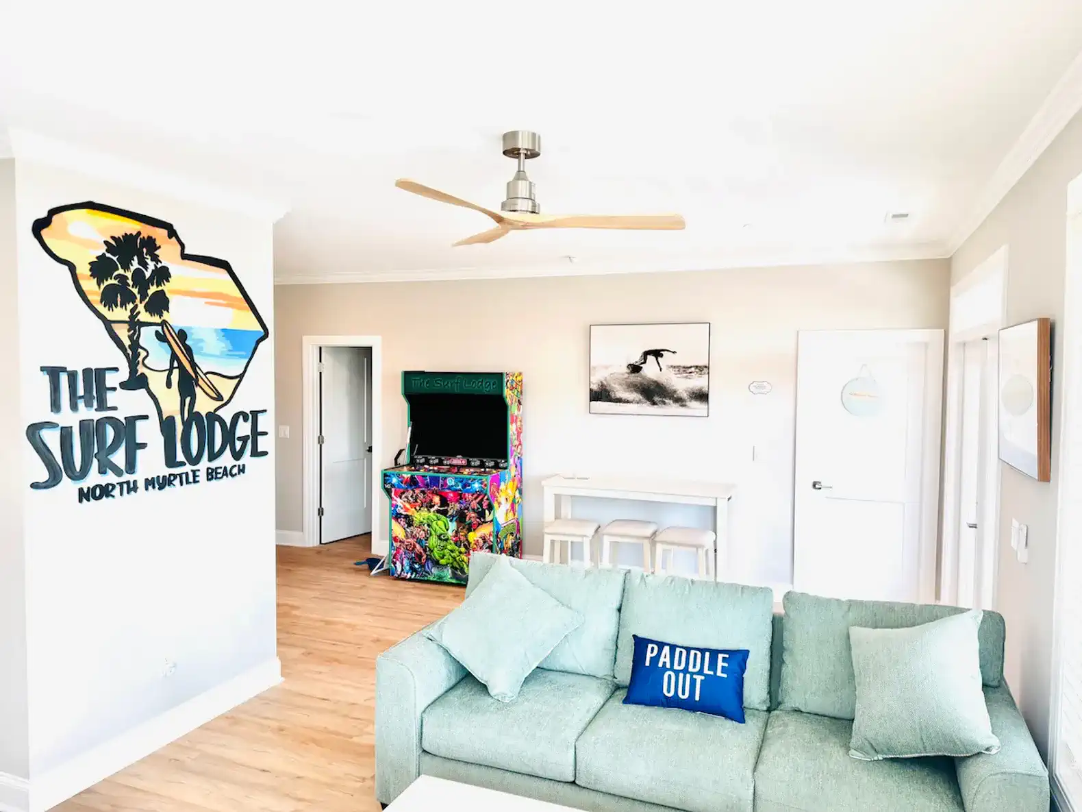 Bright living room with beach-themed decor and comfortable seating