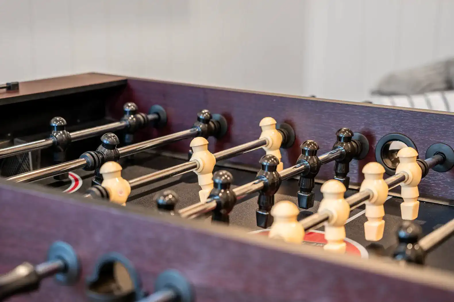 Close-up of a foosball table with players in action