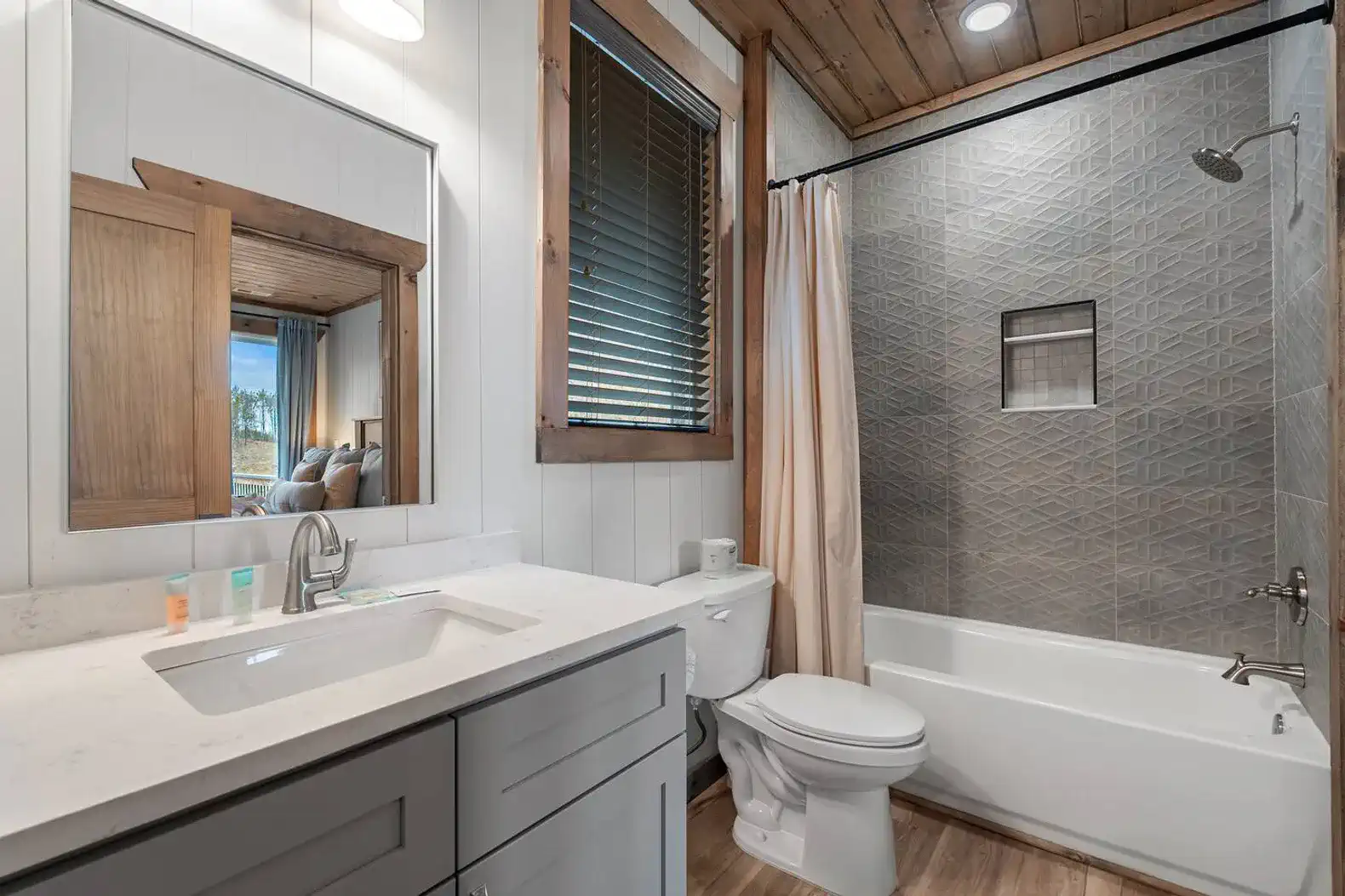 Modern bathroom with a tub, shower, and wooden accents