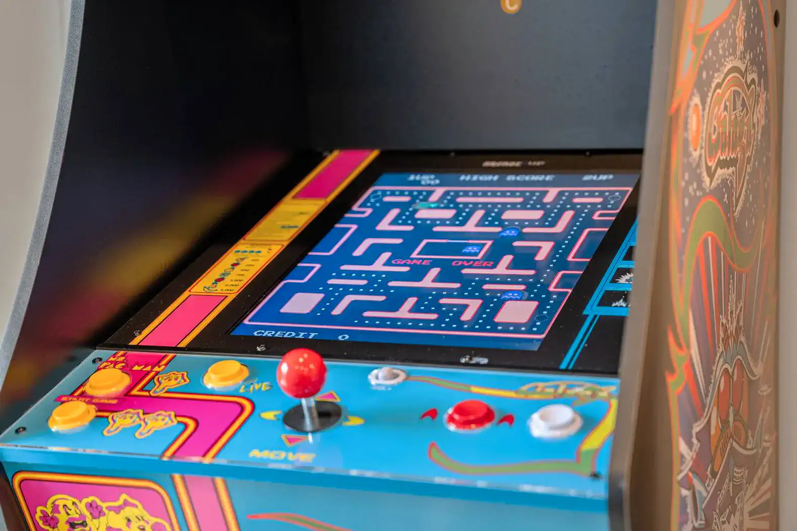 Colorful arcade game console with joystick and buttons