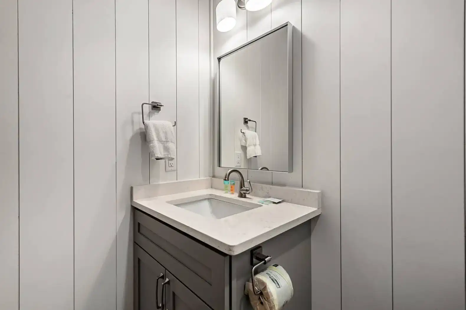 Modern bathroom with a sleek vanity and large mirror