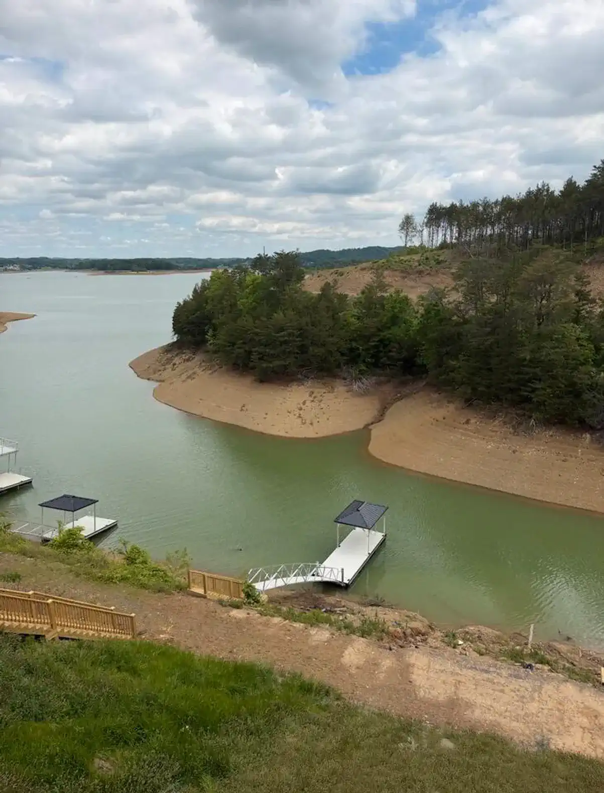Scenic view of the lake with docks and sandy shores
