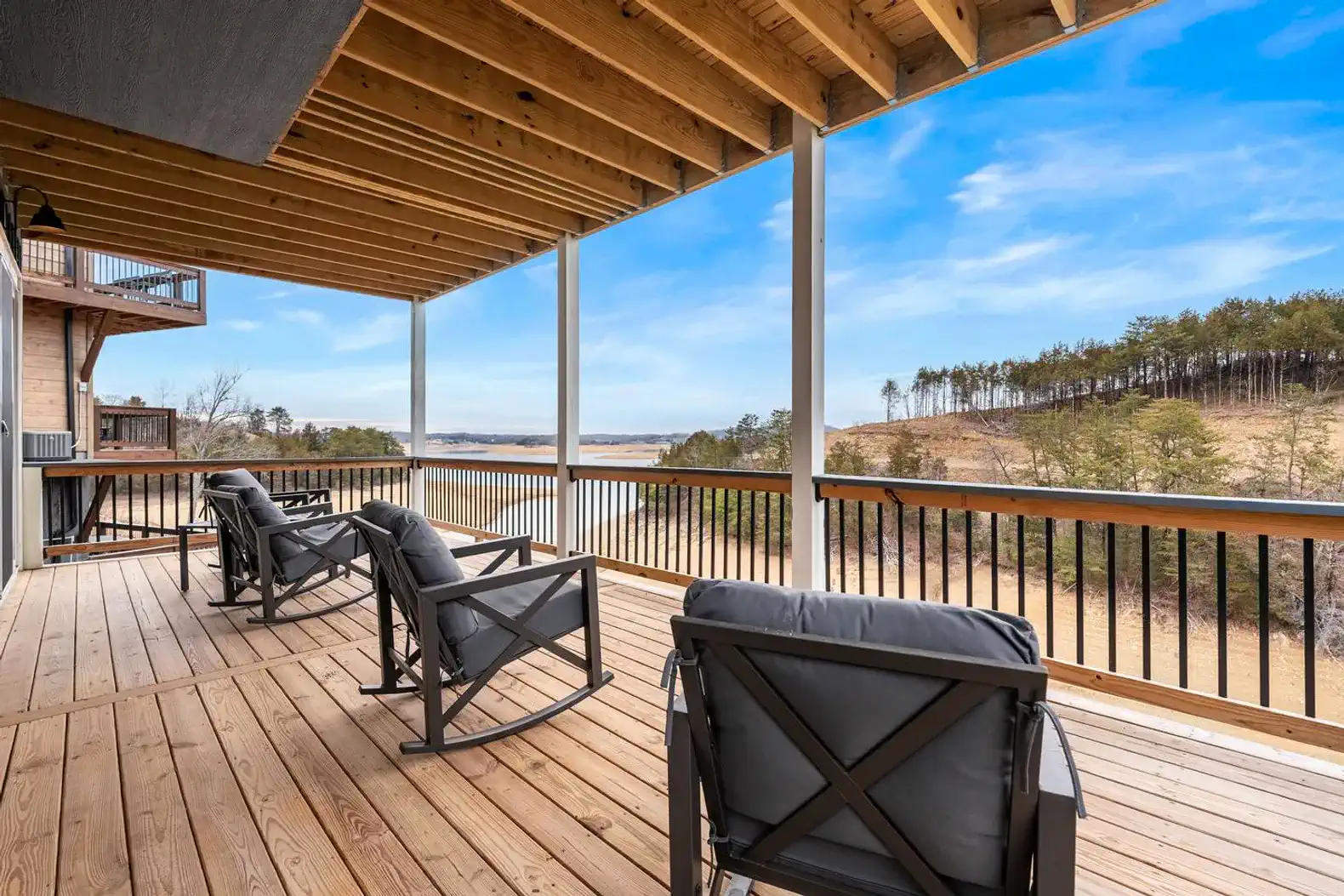 Spacious deck with comfortable seating and scenic lake views