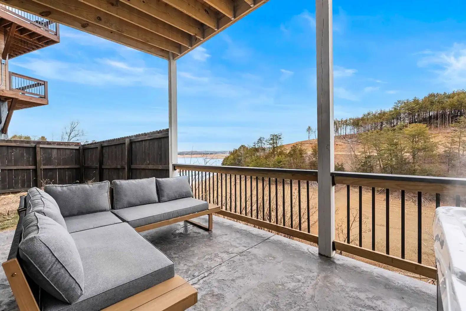 Covered outdoor seating area with lake views