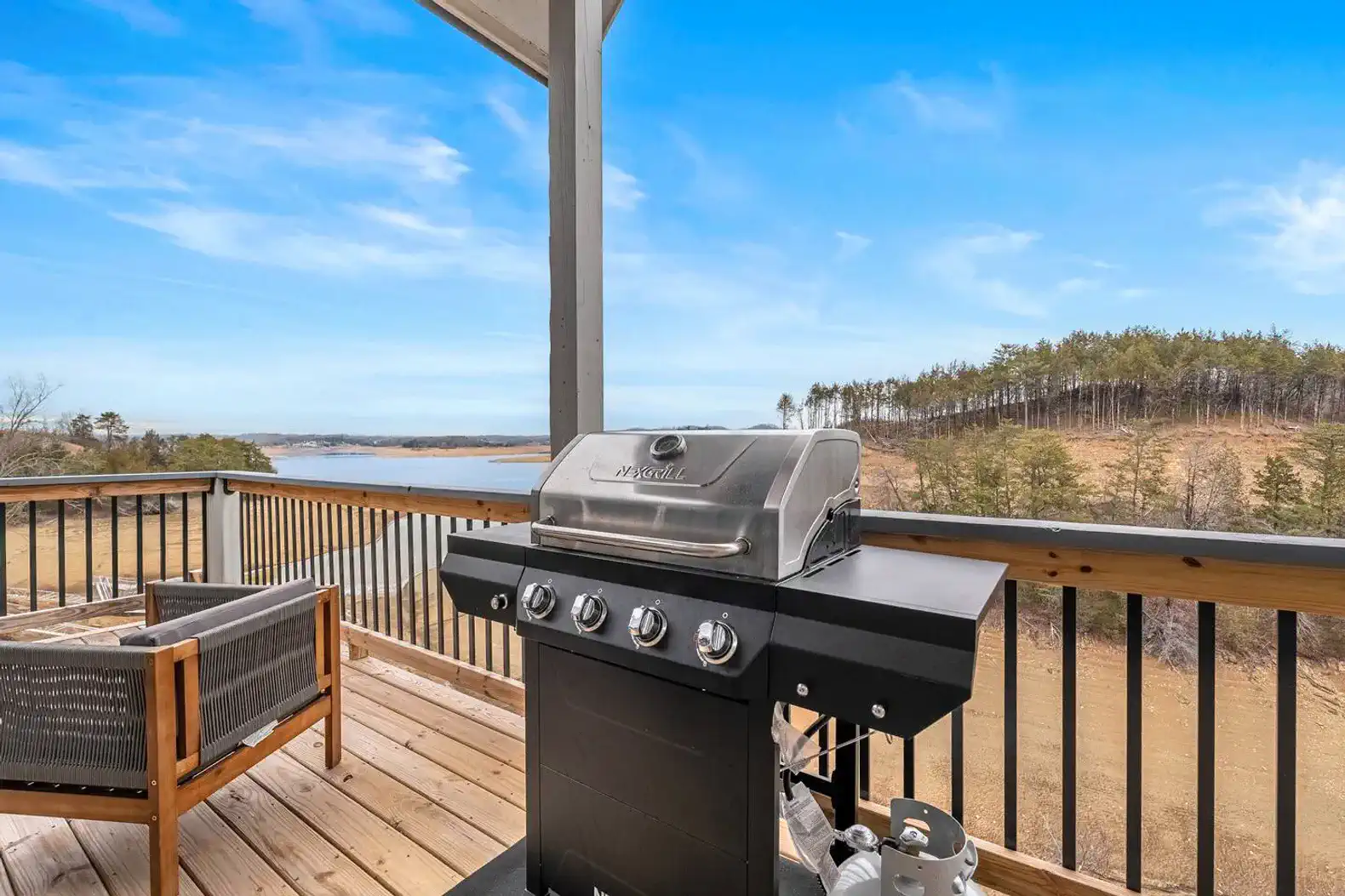 Outdoor BBQ grill with scenic lake view