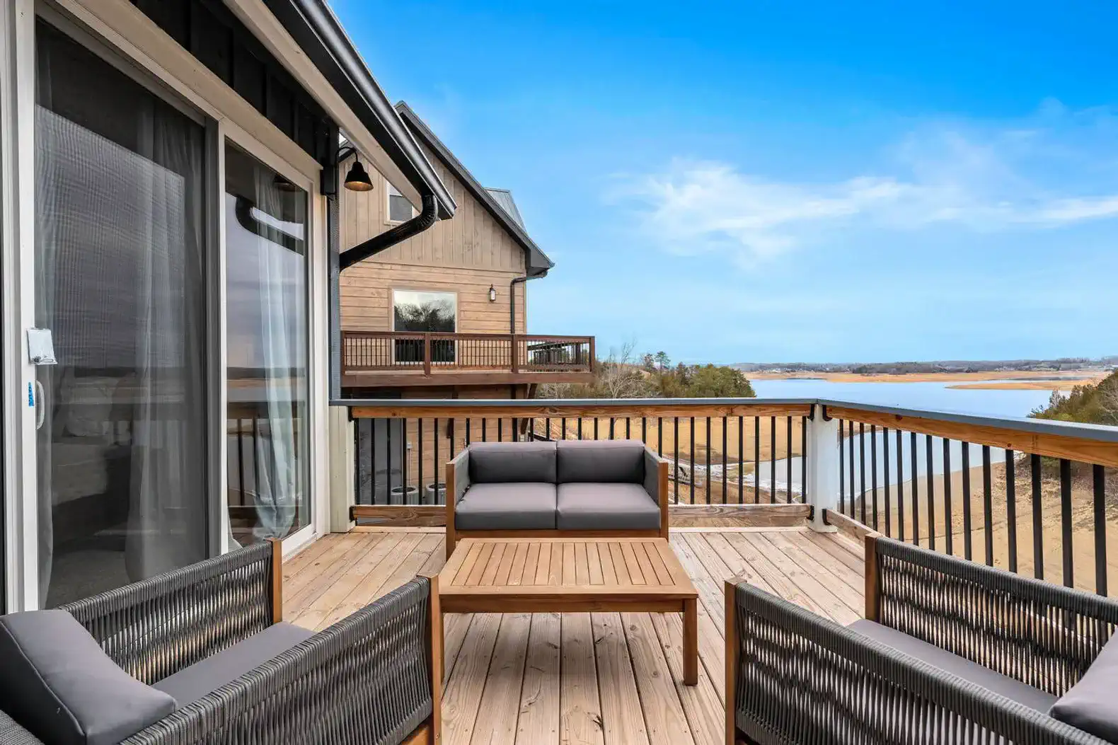 Spacious deck with seating and stunning lake views