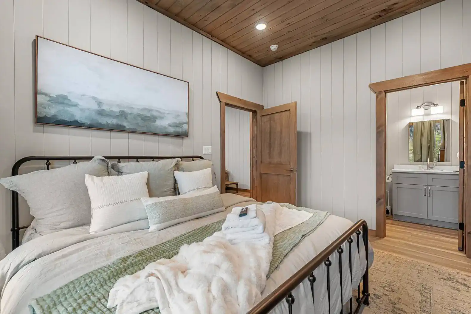 Cozy master bedroom with a comfortable bed and en-suite bathroom access
