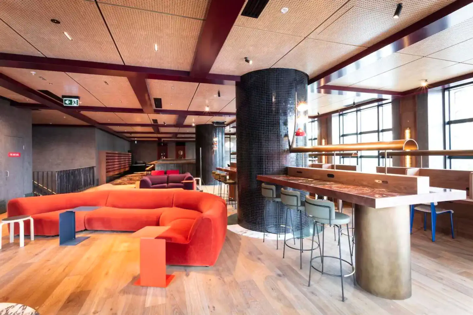 Spacious living area with modern furniture and a large bar counter