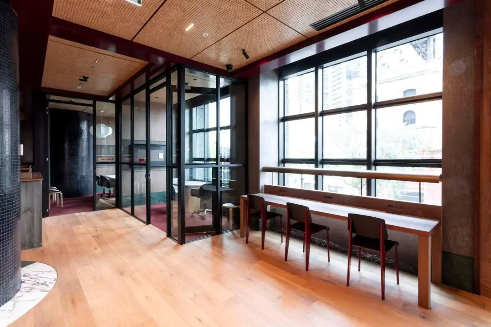Spacious dining area with large windows and modern seating
