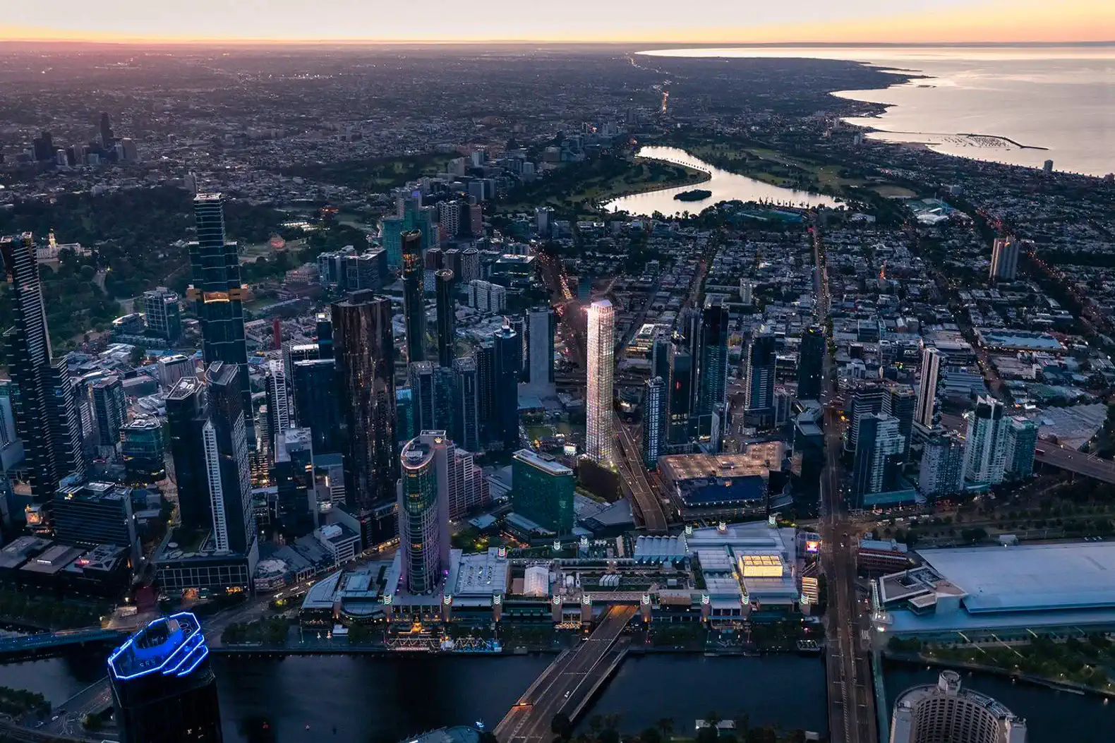 Panoramic view of Melbourne skyline at sunset with river and coastline