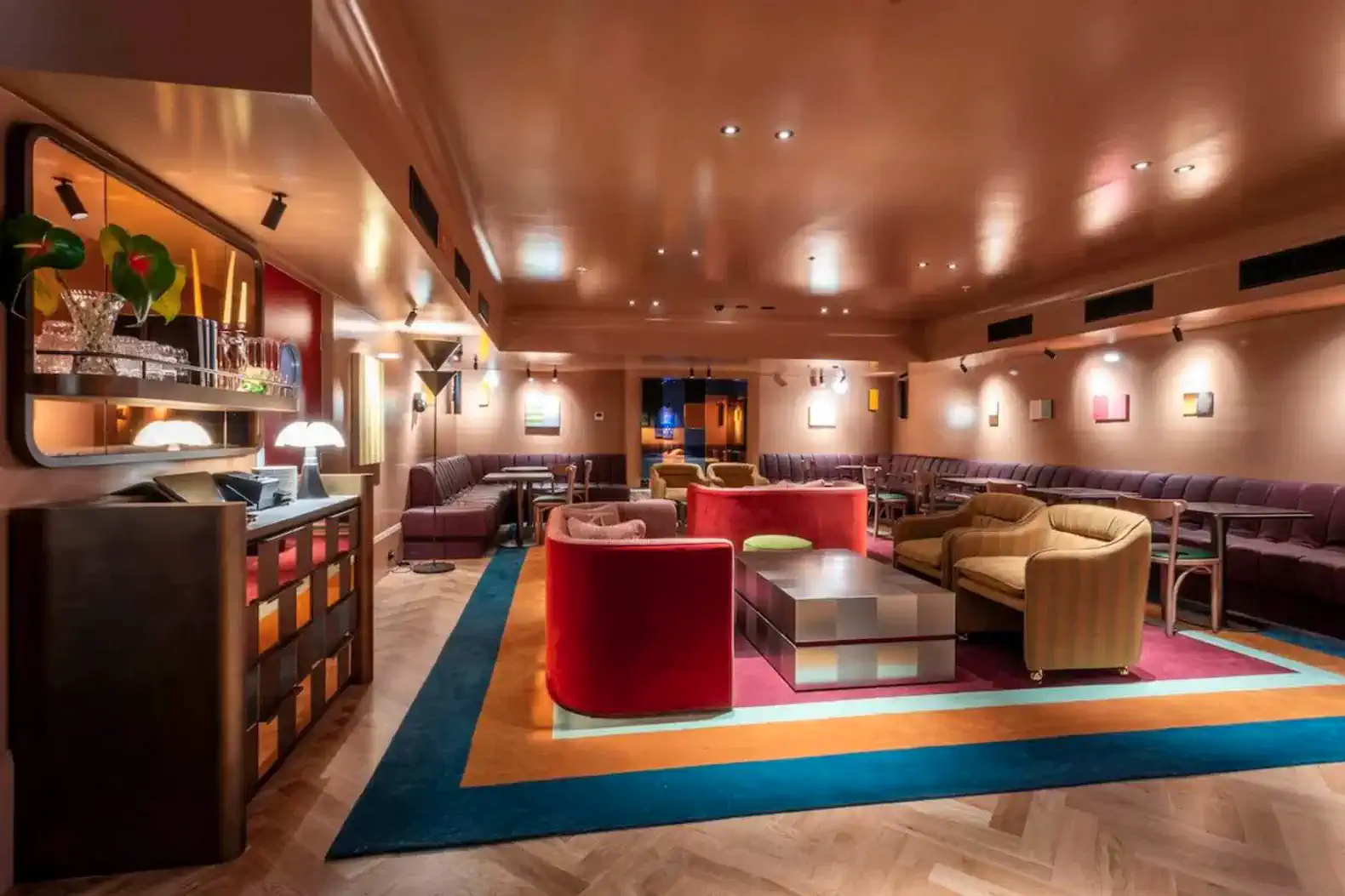 Stylish lounge area with colorful seating and modern decor