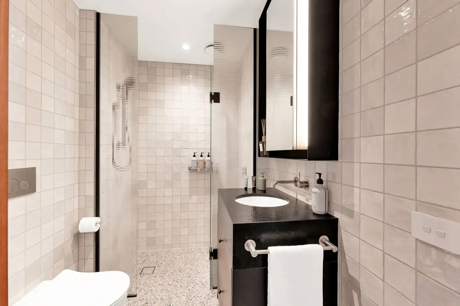 Modern bathroom with sleek fixtures and textured tiles