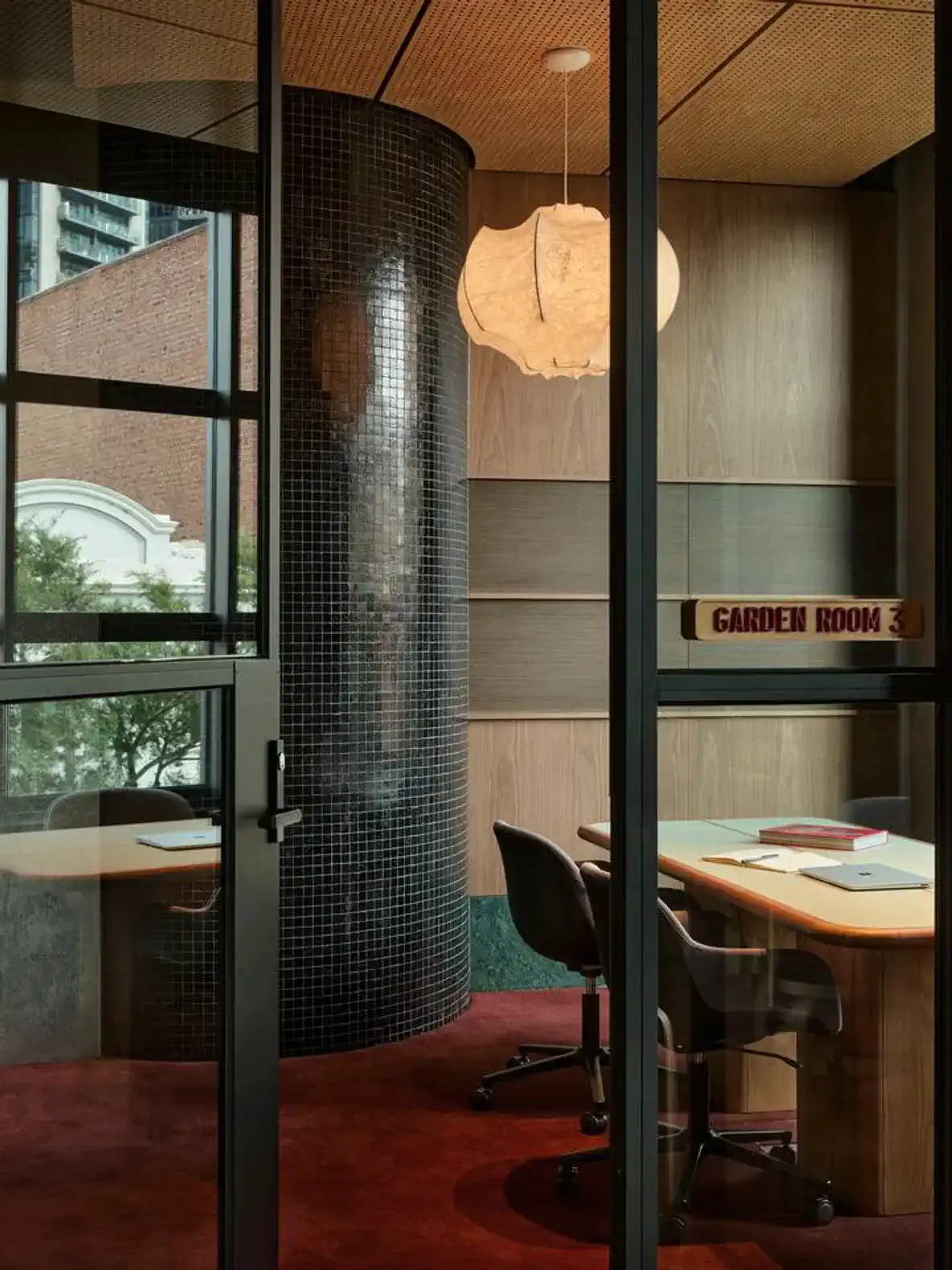 Stylish office space with modern furniture and unique lighting