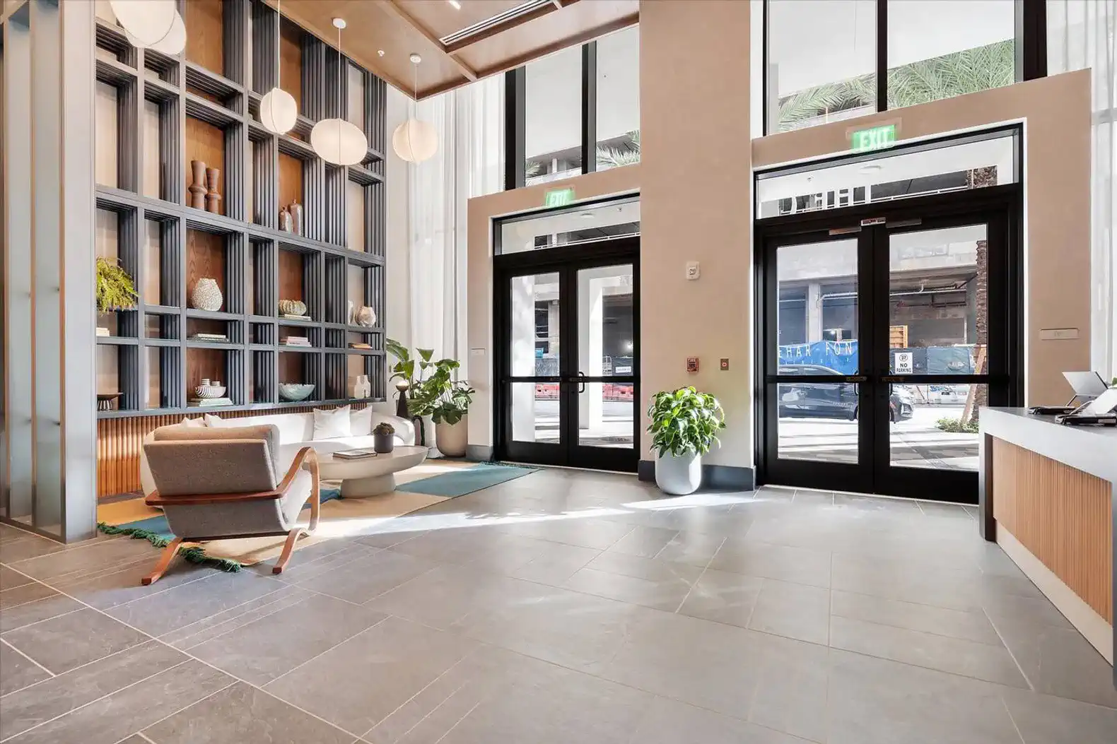 Modern lobby with stylish seating and large windows letting in natural light