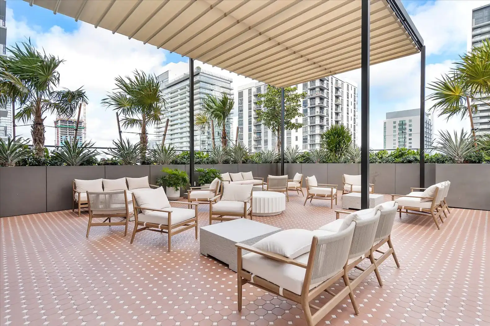 Spacious outdoor lounge area with modern seating and greenery
