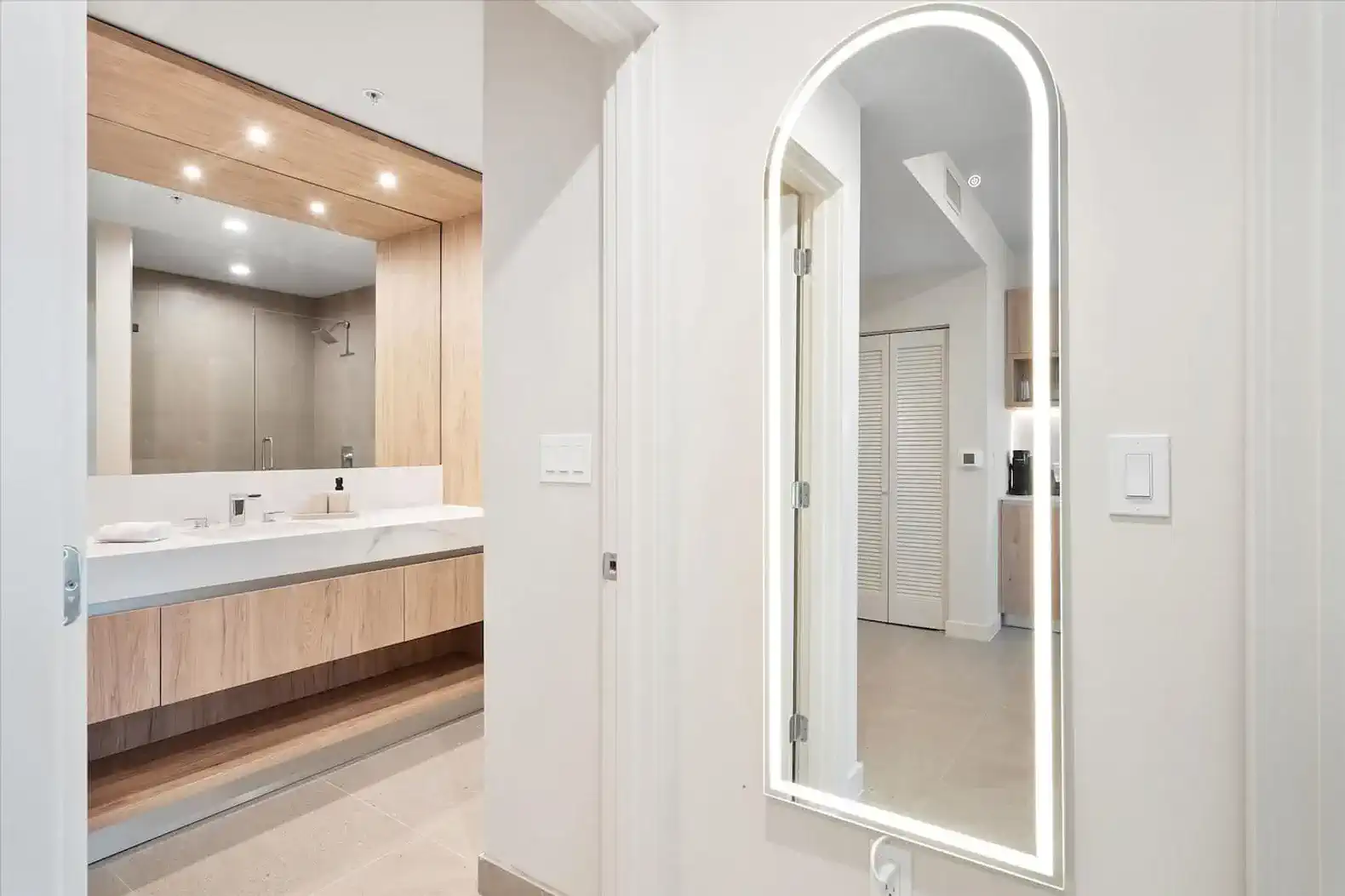 Spacious bathroom with modern fixtures and a large mirror