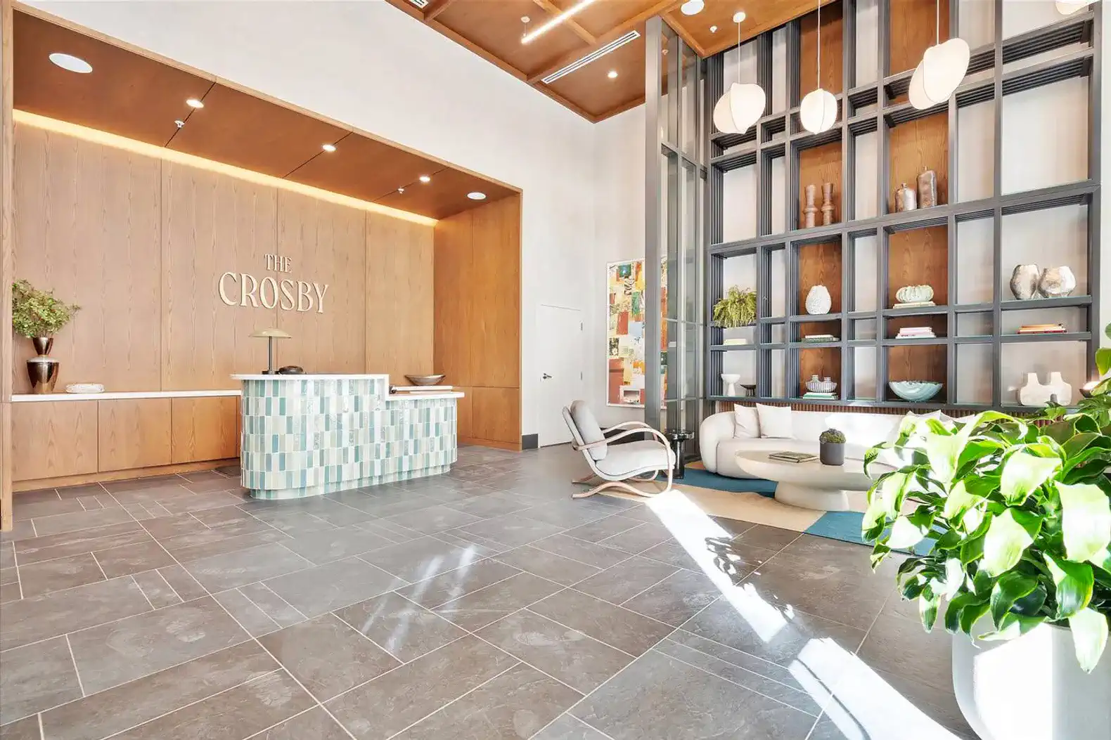 Modern lobby with stylish reception desk and decorative shelving
