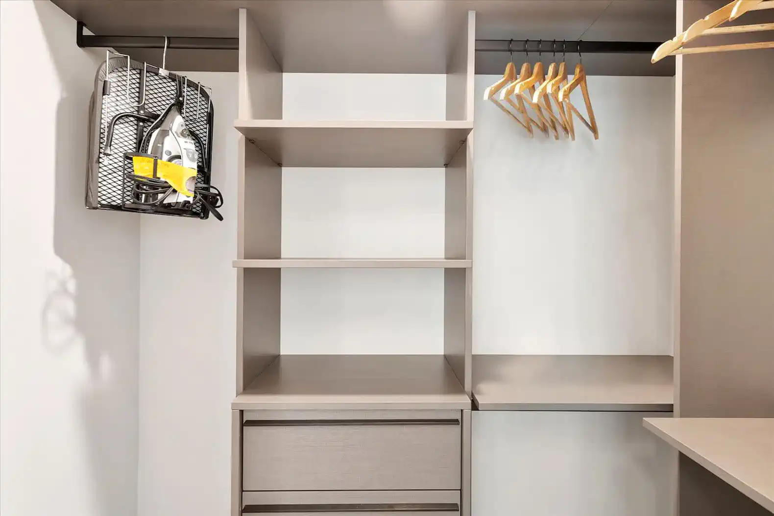 Spacious closet with shelves, hanging space, and a drawer for storage