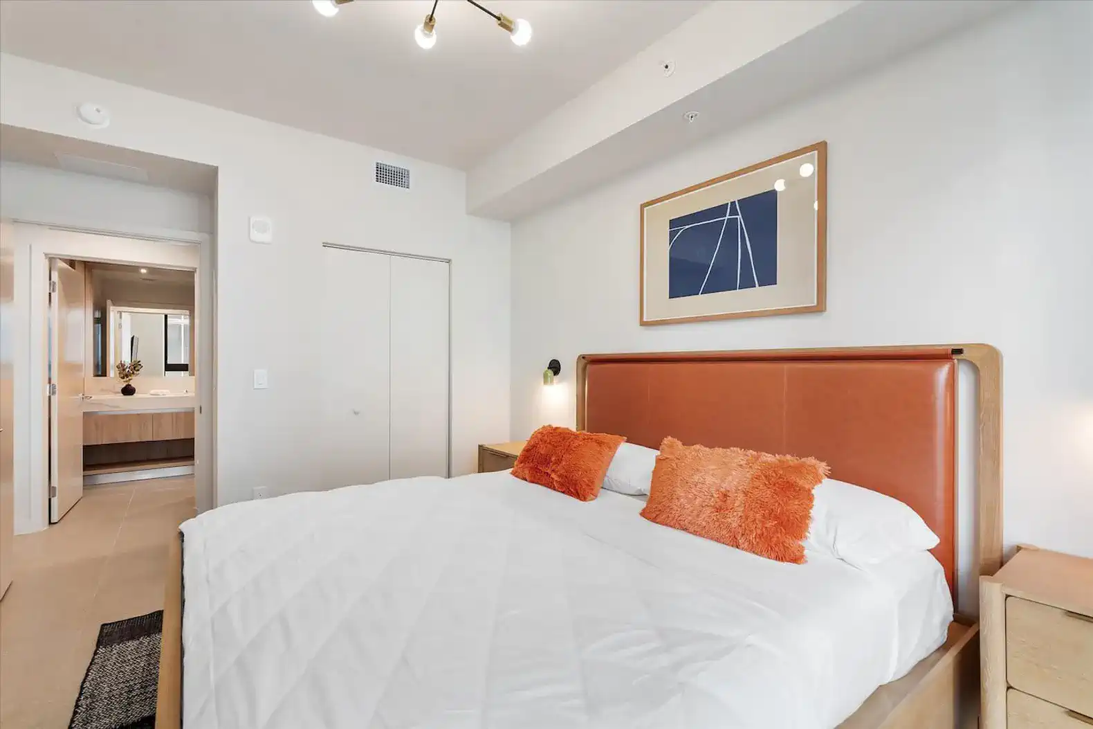 Cozy master bedroom with a large bed and modern decor
