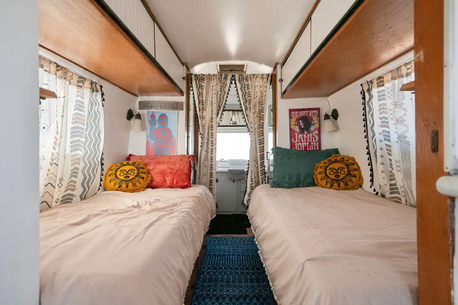 Cozy guest bedroom with two twin beds and colorful pillows