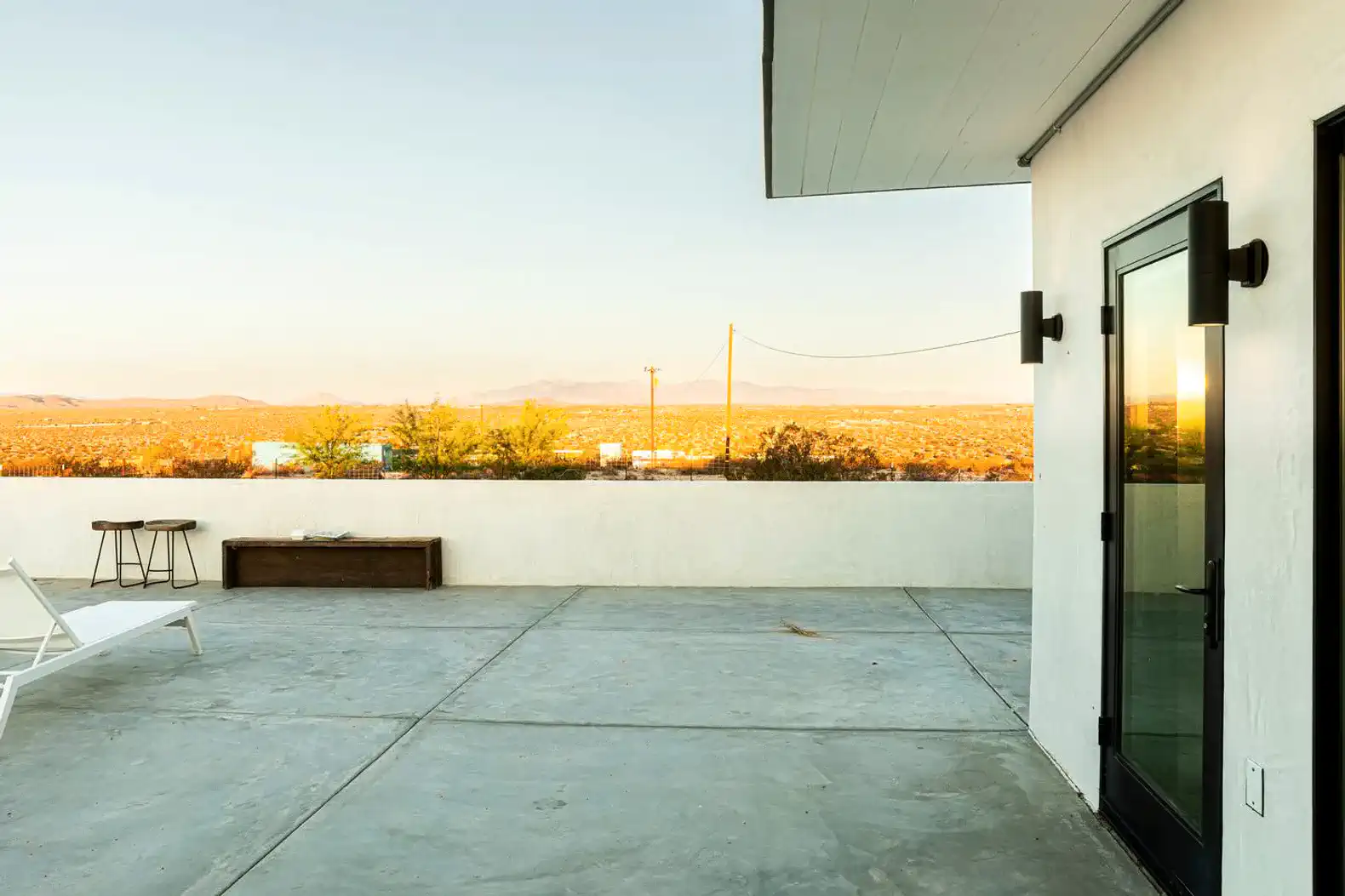 Spacious outdoor patio with stunning desert views at sunset