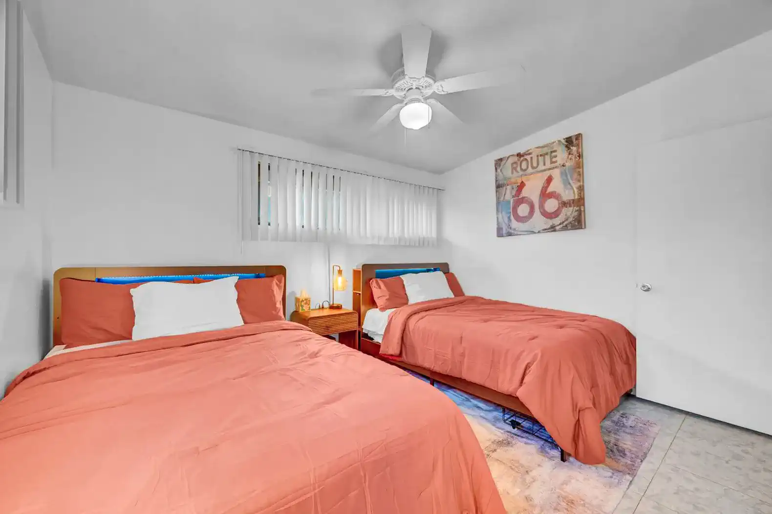 Cozy guest bedroom with two beds and Route 66 decor