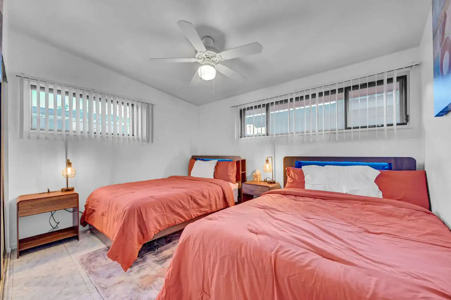 Cozy guest bedroom with two beds and natural light