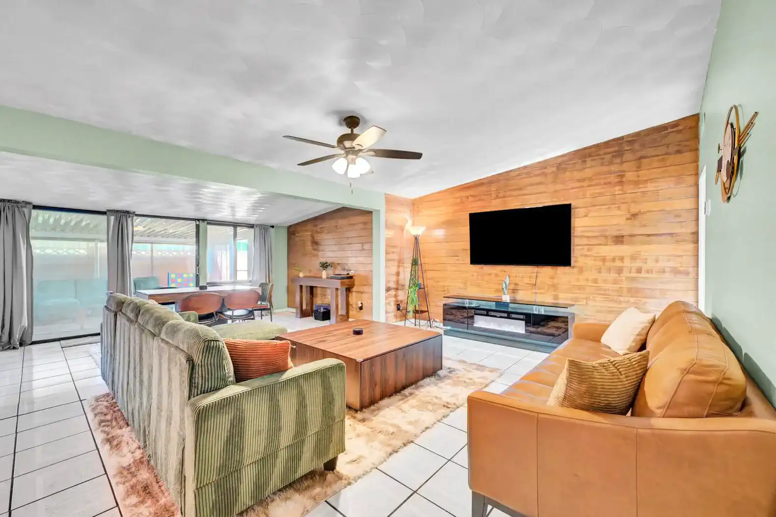 Spacious living room with wooden accents and comfortable seating