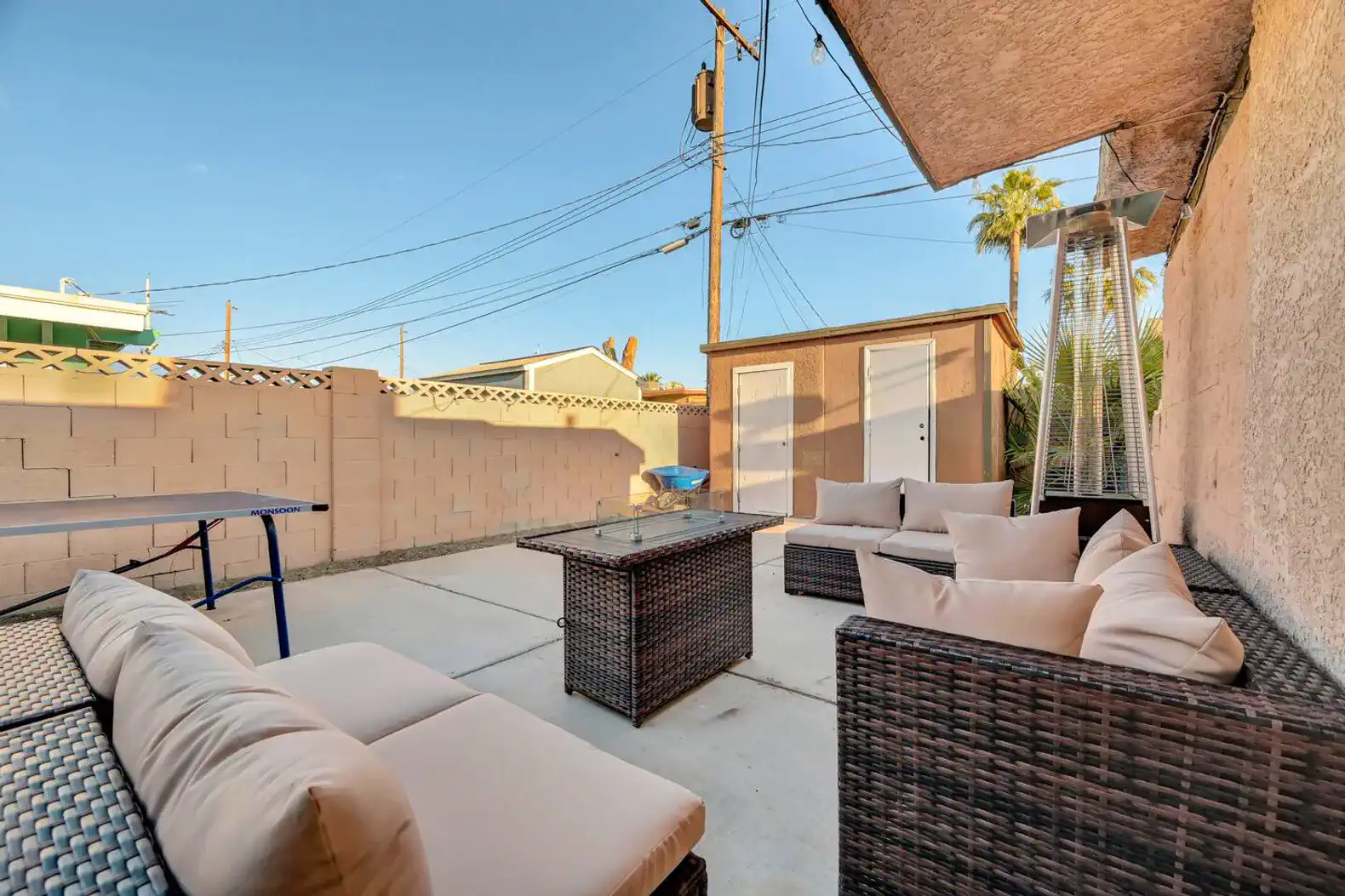 Cozy outdoor seating area with a table and lounge chairs