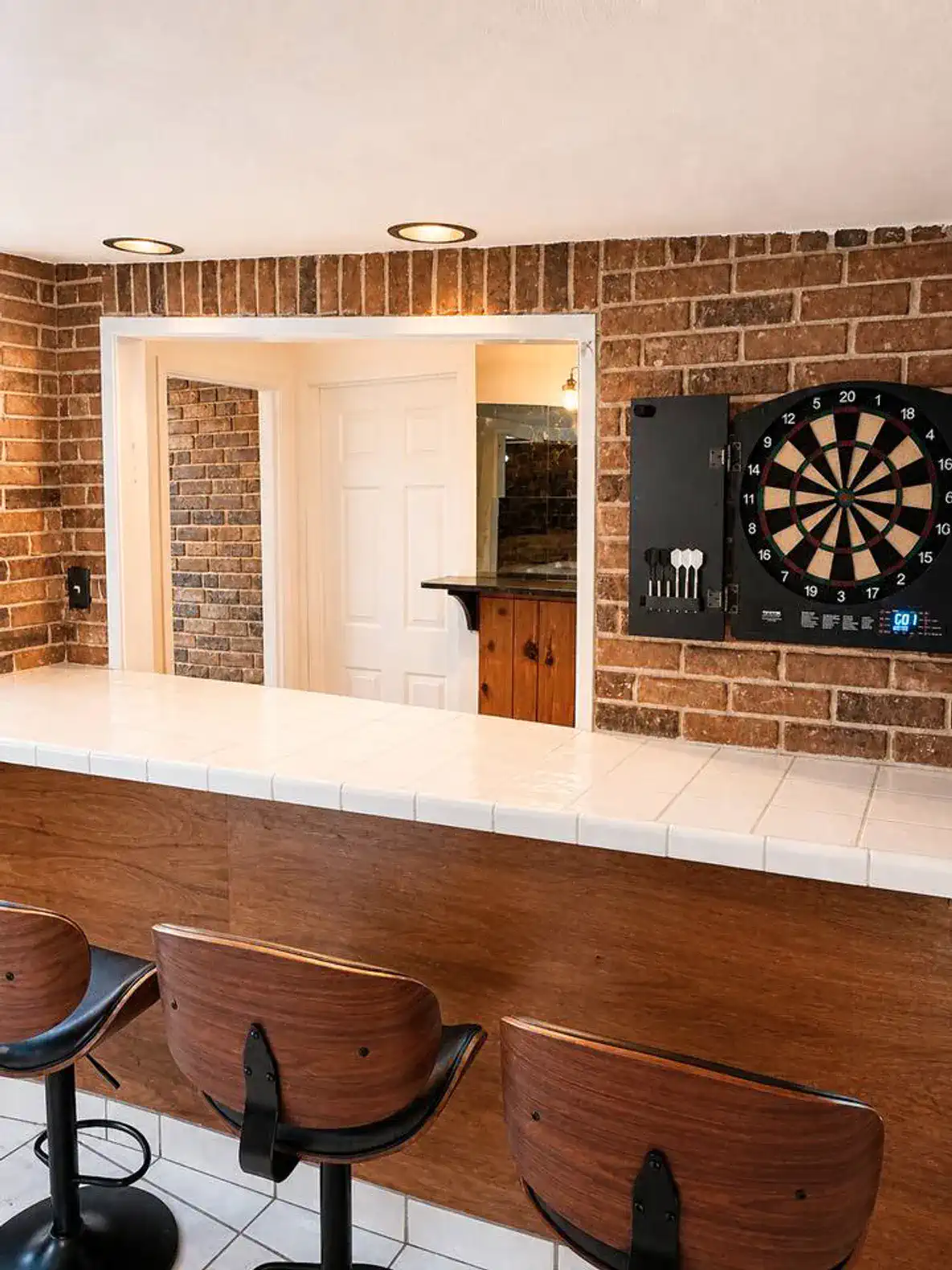 Cozy bar area with dartboard and seating