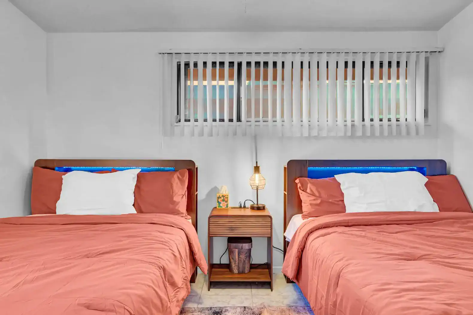 Cozy guest bedroom with two beds and modern decor