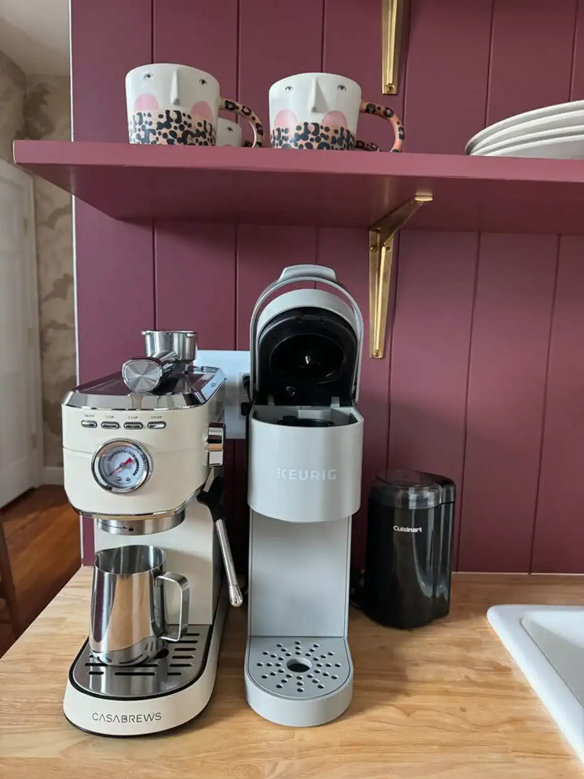 Coffee station featuring a Casabrews espresso machine and a Keurig with mugs above