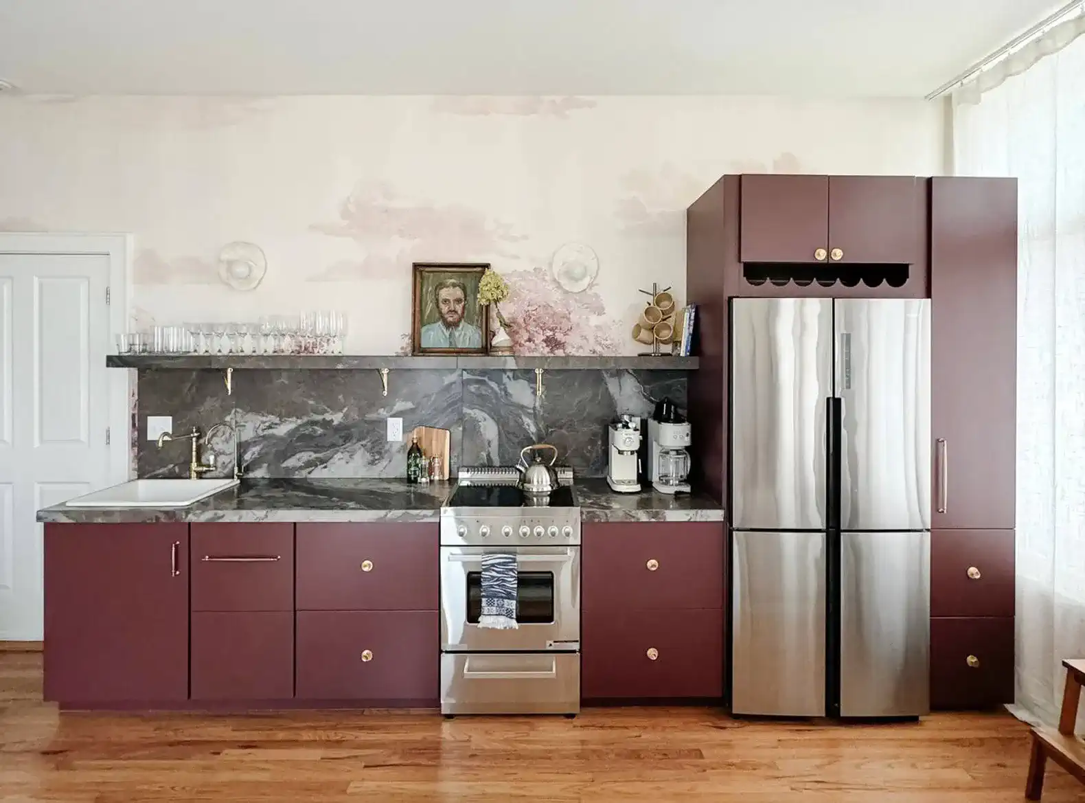 Modern kitchen with marbled countertops and stainless steel appliances