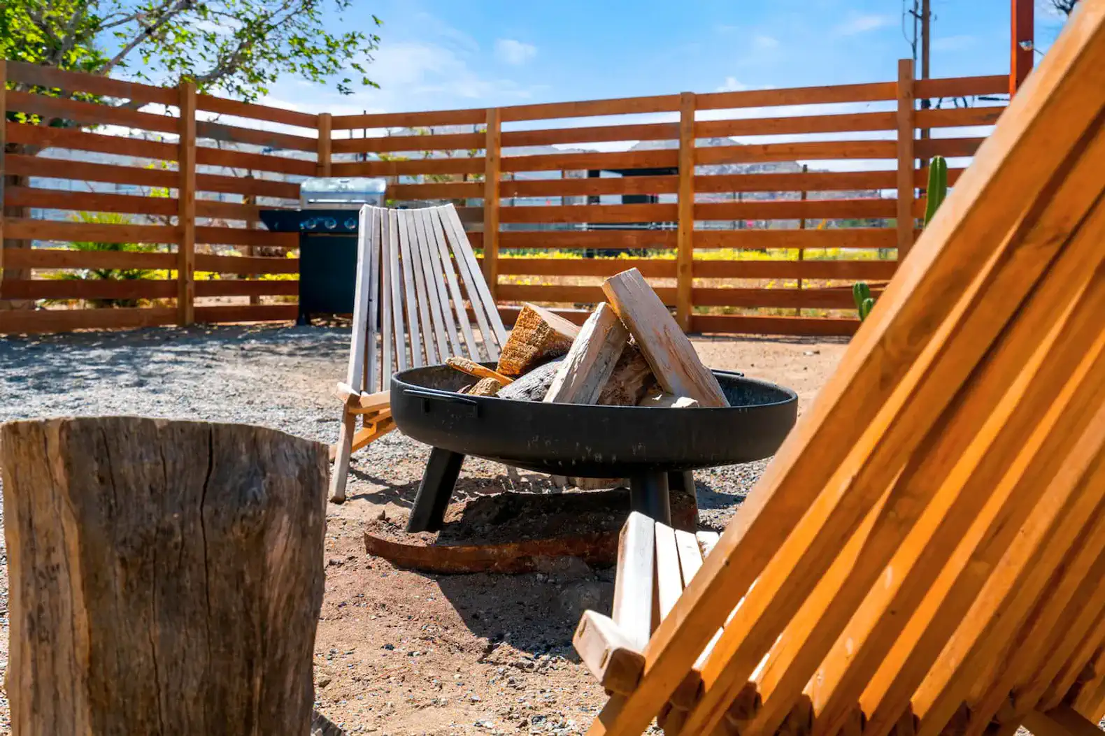 fire pit and fenced back yard