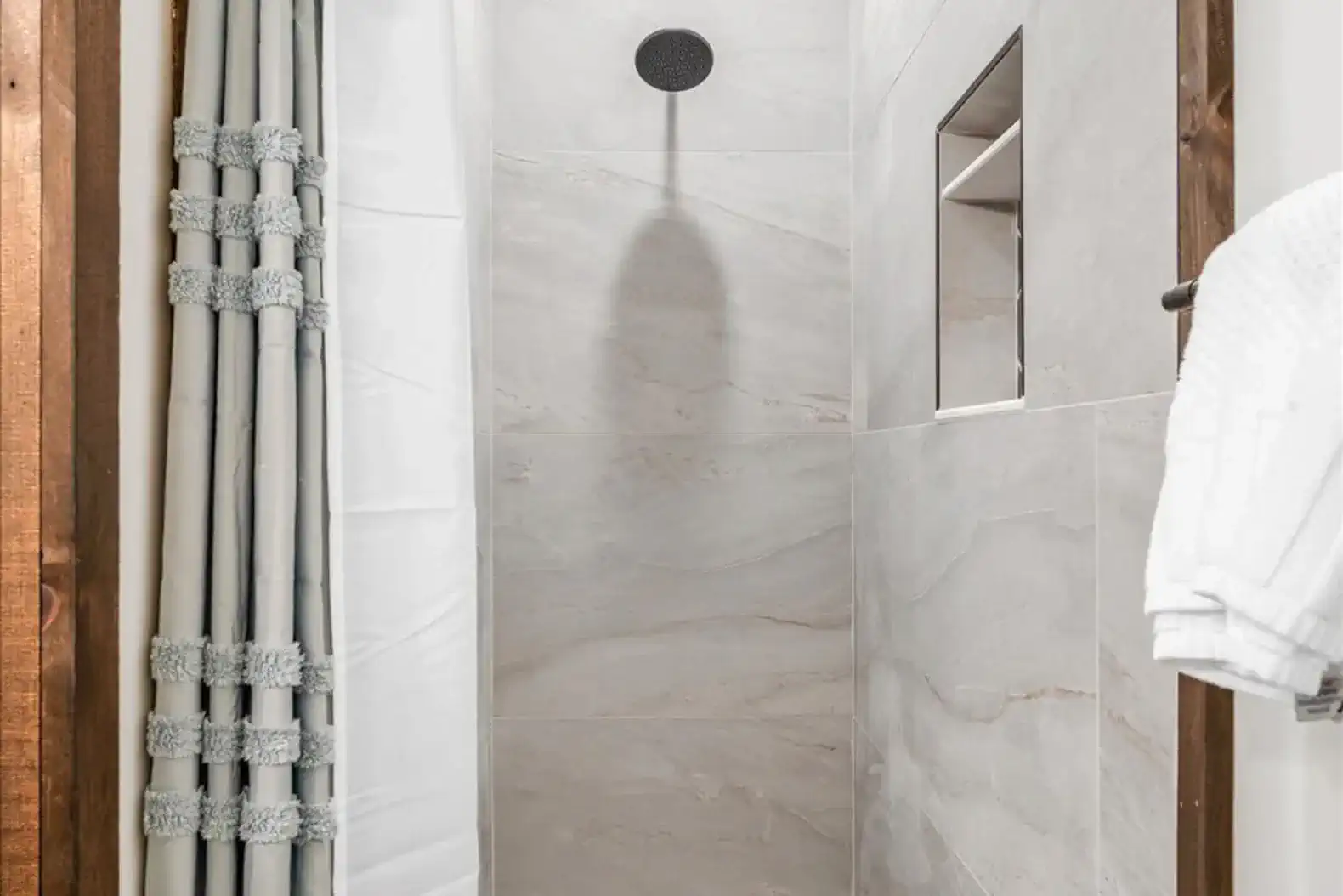 Tiled standing shower in second full bath. 