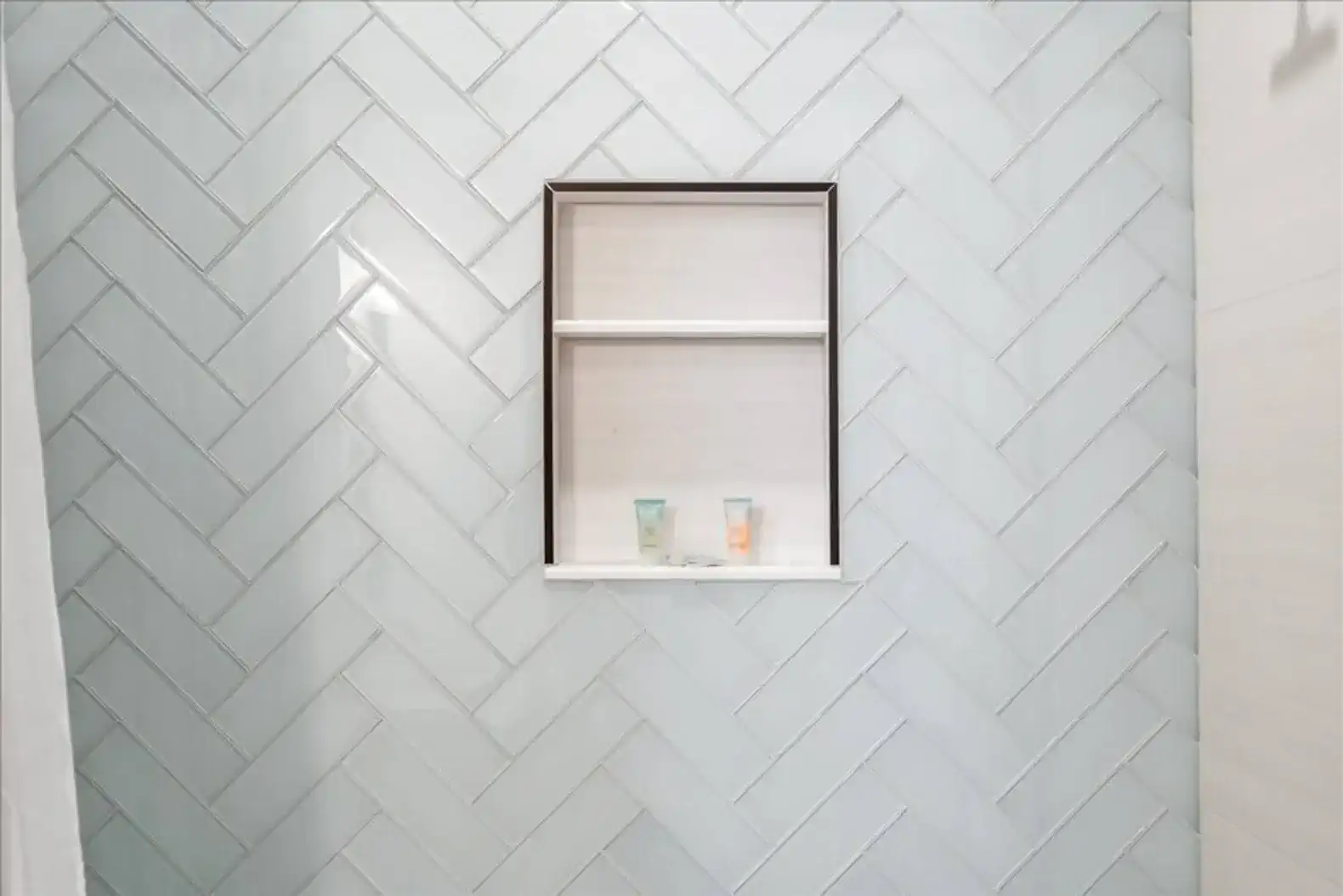 Shower shelves so you can keep things organized. 