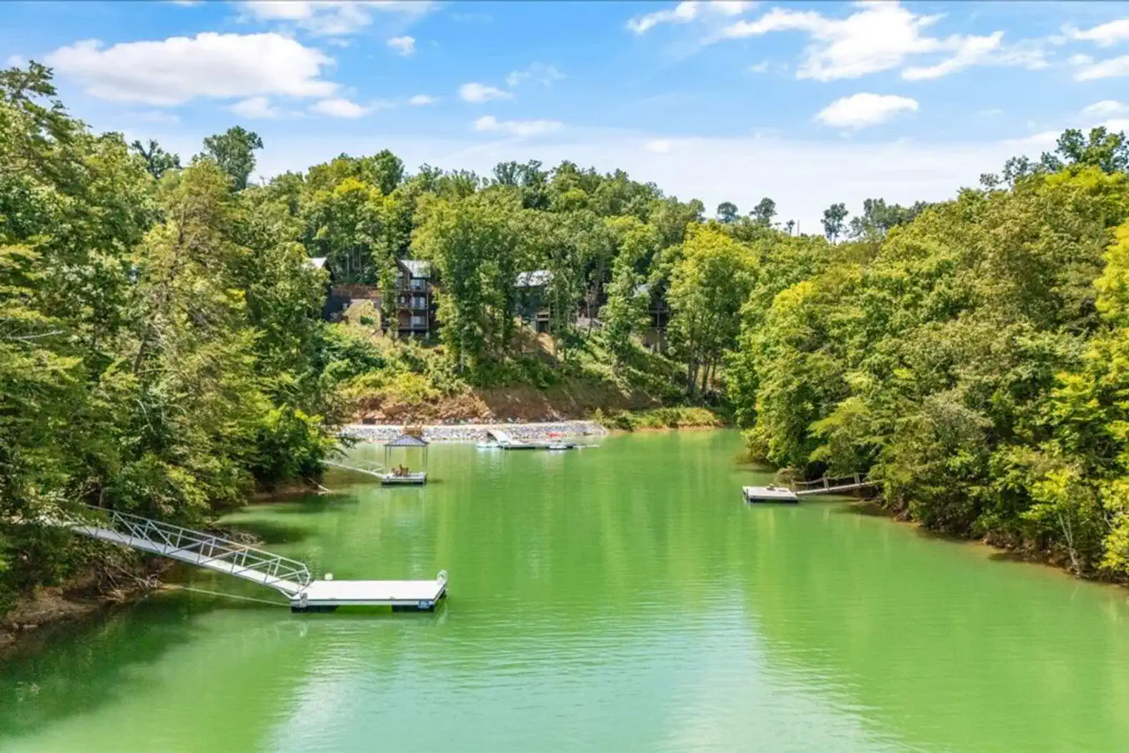Scenic view of Lake Douglas surrounded by lush greenery and docks