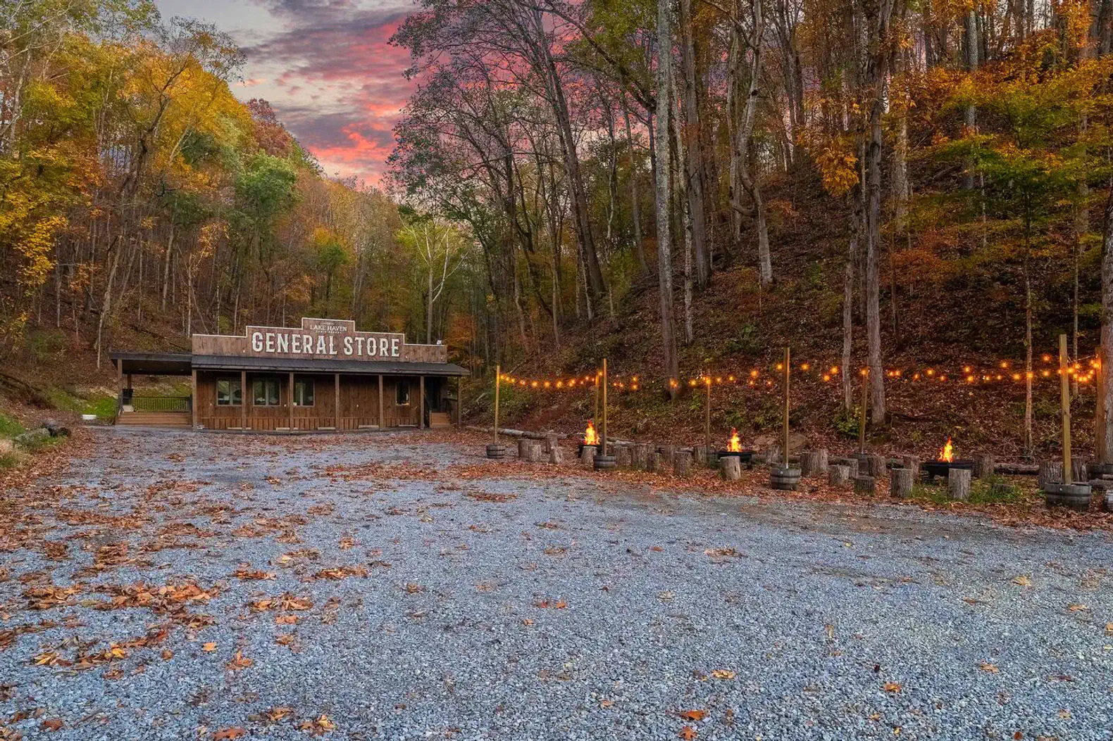Rustic general store surrounded by autumn foliage and gravel path