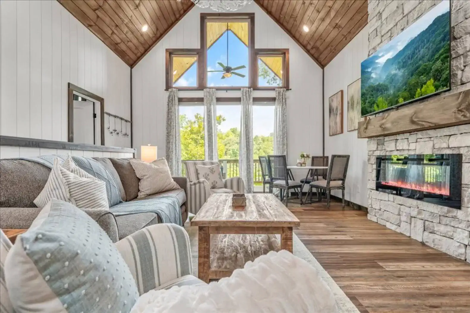 The open windows and door allow the beautiful natural light to peek in
