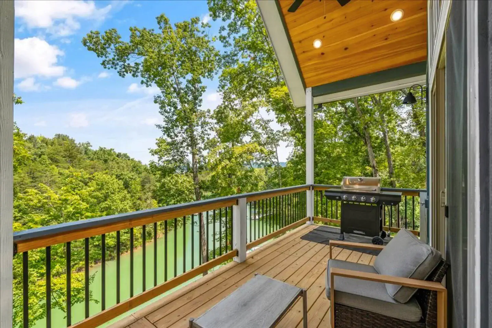 Main level back deck with water view (see description)