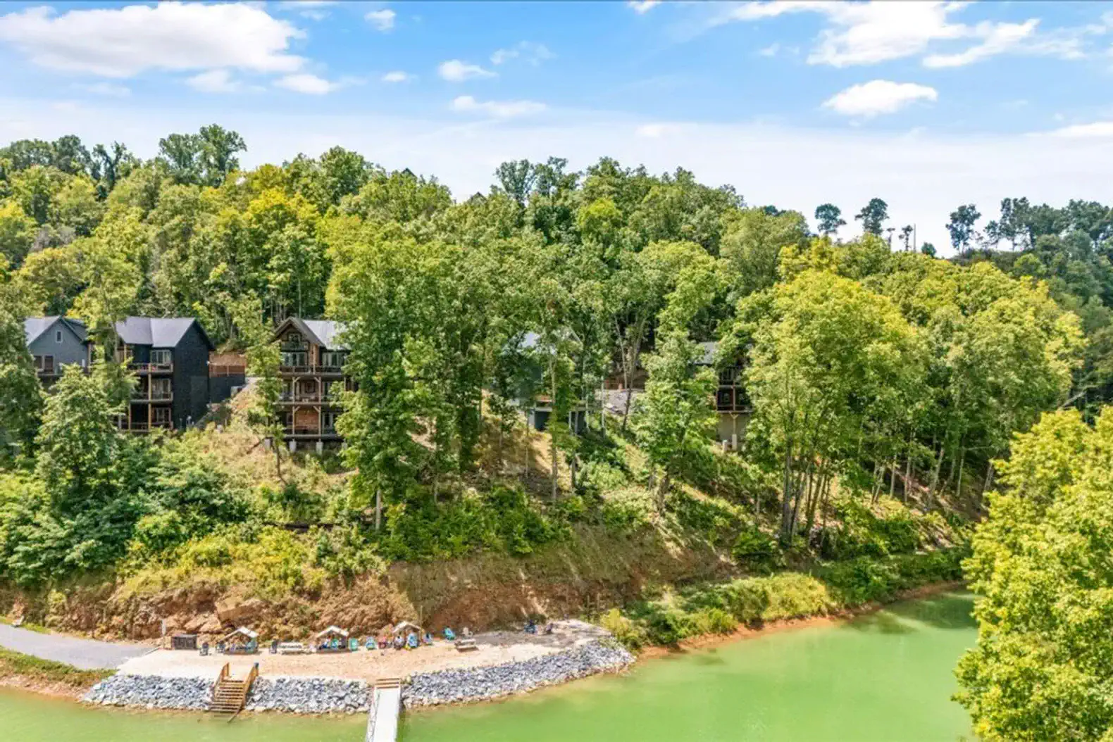 Scenic view of Lake Douglas surrounded by lush greenery and vacation homes