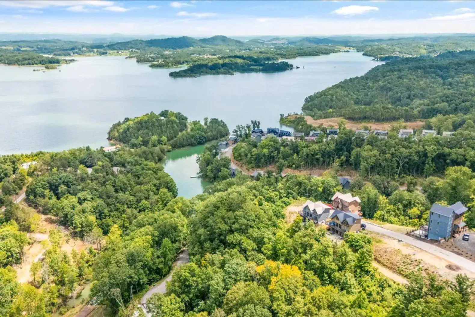 Scenic view of Lake Douglas surrounded by lush greenery and hills